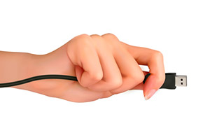 Woman's hand with a USB cable